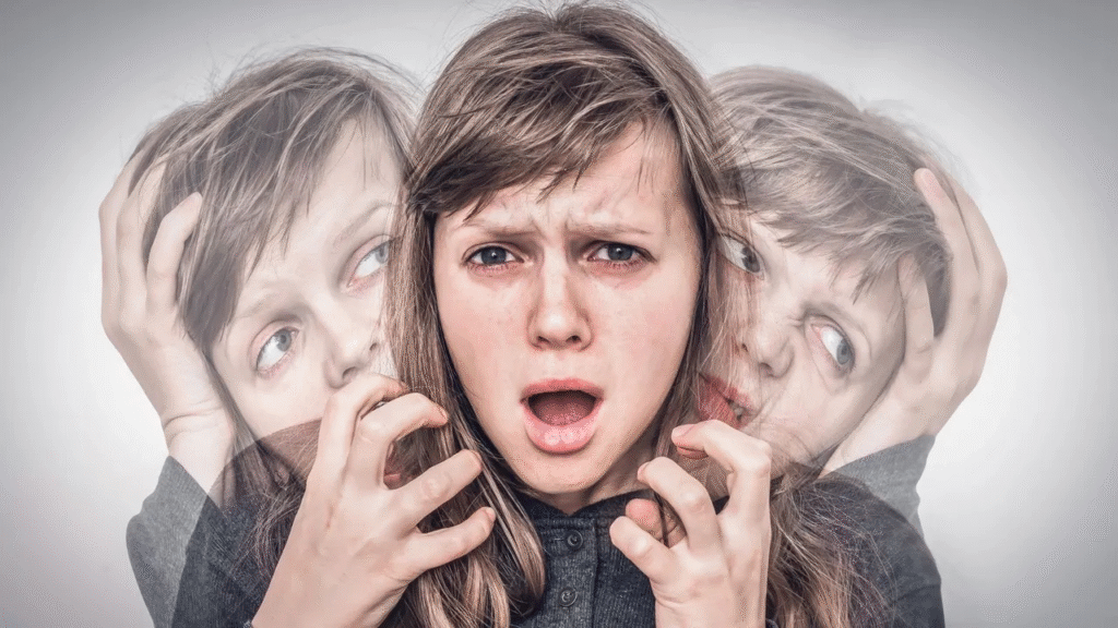 Anxious person struggling with intrusive violent thoughts, holding their head in distress.