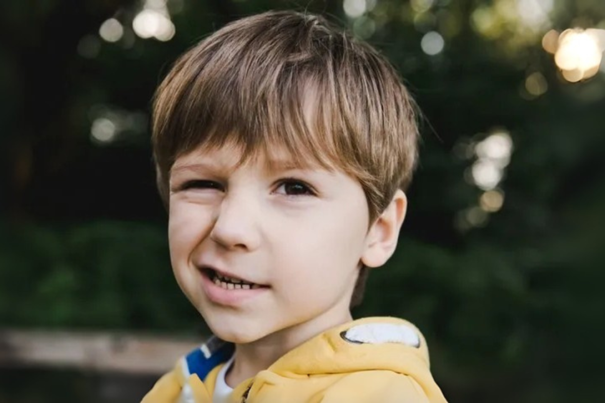 Person experiencing Tourettic OCD with both tics and obsessive-compulsive behaviors